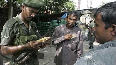 A Sri Lankan soldier mans a roadside checkpoint in Colombo, Sri Lanka 