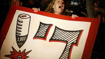 An Israeli woman shouts as she joins about a hundred protesters in front of the Israeli Prime Minister's residency demonstrating against the ongoing Israeli military action against Gaza, in Jerusalem, Thursday, Jan. 1, 2009. 