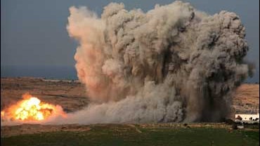 An explosion from an Israeli strike in the northern Gaza Strip is seen from the Israeli side of the border with Gaza 