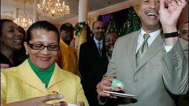 Mayor Ray Nagin, joined by his wife Seletha, holds a plastic baby, he pulled from his slice of the ceremonial first king cake of the Carnival season at Gallier Hall in New Orleans, Tuesday, Jan. 6, 2009. By tradition, the person who finds the baby in a sl 