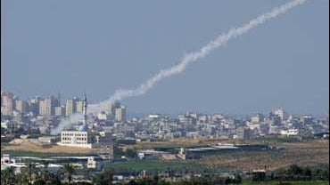 A smoke trail from a rocket fired by Palestinian militants inside the Gaza Strip is seen 
