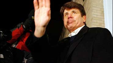 Former Illinois Gov. Rod Blagojevich waves to his supporters after talking to the media outside of his Chicago home 
