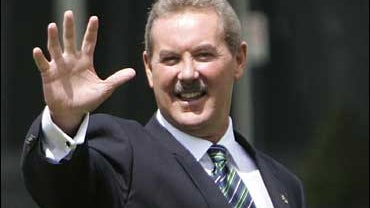R. Allen Stanford waves at Lords Cricket Ground in London 