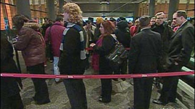 Job seekers wait in line 