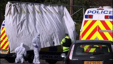 Police at the scene of a shooting at Massereene Barracks in Antrim, Northern Ireland, after two soldiers were shot dead outside the army barracks last night. 