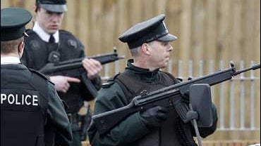 Police Service of Northern Ireland officer's takes up position near Lismore Manor, Craigavon 