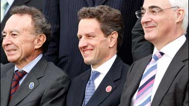 U.S. Treasury Secretary Timothy Geithner, center, poses for a photo with Britain's Chancellor of the Exchequer Alistair Darling, right, and Mexican Central Bank Governor Guillermo Ortiz 