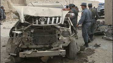 A damaged vehicle is seen at the site of a blast in Kandahar province south of Kabul, Afghanistan 