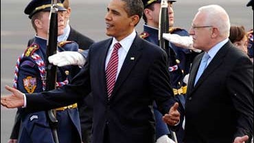 President Barack Obama gestures as he walks with Czech President Vaclav Klaus 