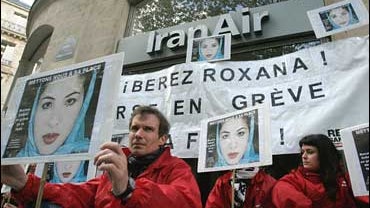 Members of Reporters Without Borders, hold placards with the picture of American journalist Roxana Saberi jailed in Iran, outside the Iran Air office in Paris Tuesday, April 28, 2009. 