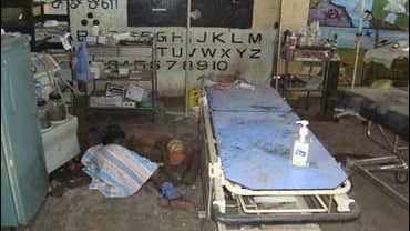 Dead bodies are seen lying inside a ward in a makeshift hospital after it was shelled in Mullivaaykkaal, Sri Lanka, Saturday, May 2, 2009. 