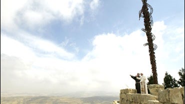 Pope Benedict XVI and Minister General of the Order of Friars Minor Jose Rodriguez Carballo stand close to the Antique Basilica and Moses Memorial on Monte Nebo where the Bible says Moses saw the Promised Land, in Amadaba City, Jordan, Saturday, May 9, 20 
