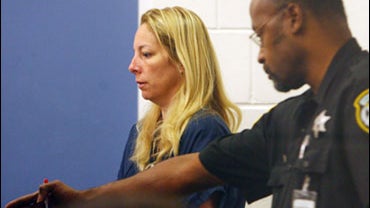 Bonnie Sweeten, left, who claimed she and her daughter had been kidnapped but instead turned up at Walt Disney World, makes her initial court appearance Friday, May 29, 2009 at the Orange County jail in Orlando, Fla. 
