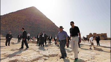 U.S. President Barack Obama, right, is escorted on a tour of the pyramids near Cairo, Thursday, June 4, 2009. 