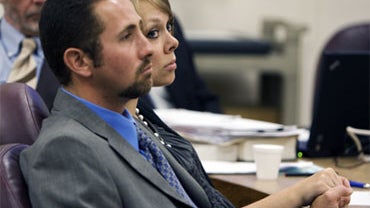 Carl and Raylene Worthington hold hands during opening statements on Monday, June 29, 2009 in Clackamas County Circuit Court in Oregon City, Ore. 
