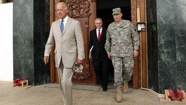 U.S. Vice President Joseph Biden, left, U.S. Ambassador Christopher Hill, center, and Gen. Ray Odierno are seen at a U.S. military base near Baghdad, Iraq, Friday, July 3, 2009. 