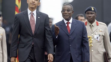 US President Barack Obama walks with Ghana President John Atta Mills, right, at the Presidential Palace in Accra, Ghana, Saturday, July 11, 2009. 