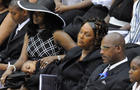 The family of Steve McNair, including his brother, Fred McNair, second from right, his mother, Lucille McNair, third from right, and his wife, Mechelle McNair, second from left, attend the former NFL star's funeral service in Hattiesburg, Miss., Saturday, 
