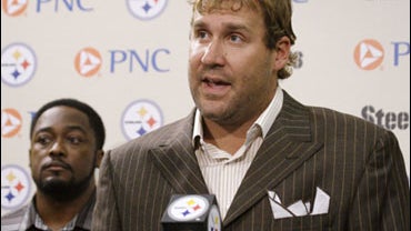 Pittsburgh Steelers quarterback Ben Roethlisberger, right, makes a statement at the Steelers offices in Pittsburgh, as coach Mike Timlin looks on, Thursday, July 23, 2009. Roethlisberger says allegations by a Lake Tahoe casino hostess that he raped her a  