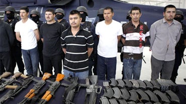 Alleged members of the Beltran Leyva drug cartel are presented by federal agents in Mexico City, June 26,2009. 
