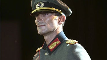 This photo made available by Mediafaxfoto on Tuesday July 21, 2009, shows Constanta Major Stefan Mazare wearing a Nazi uniform and displaying a swastika during a fashion show in the nearby Black Sea resort town of Mamaia in this picture taken Sunday, July 