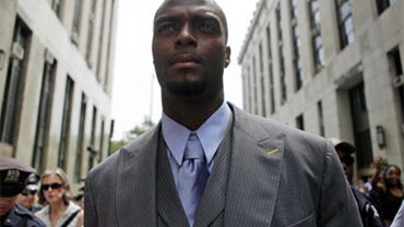 Plaxico Burress leaves Manhattan Criminal Court after testifying to a Grand Jury, Wednesday, July 29, 2009 in New York. Burress says he told the truth before the grand jury that's investigating a weapon charge against him. Burress also told reporters outs 