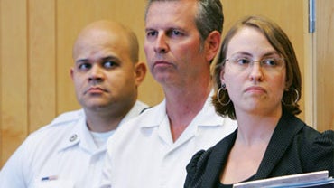 Kevin Provencher, a sports writer for the Union Leader newspaper in Manchester, NH, stands in Lawrence District Court with his attorney Jessica Thrall during his arraignment for two counts of deriving support from a prostitute in Lawrence, Mass., Wednesda 