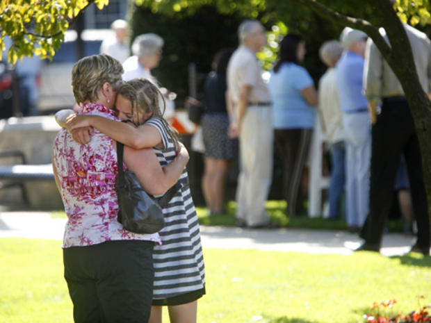 eople hug before a funeral mass outside of Our Lady of Victory Roman Catholic Church in Floral Park, NY, Thursday, July 30, 2009. The mass was for Diane Schuler, Erin Schuler, Kate Hance, Alyson Hance and Emma Hance, all of whom died in a minivan going in 