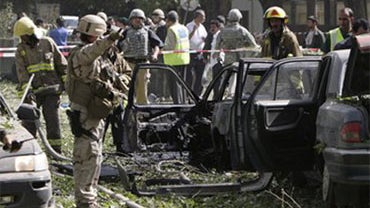 Destroyed vehicles at site of suicide car bomb explosion near main gate of NATO's headquarters in Kabul, Afghanistan, Saturday Aug. 15, 2009 