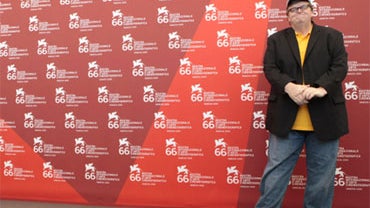 Filmmaker Michael Moore poses during the photo call for the film "Capitalism: A Love Story," at the 66th edition of the Venice Film Festival in Venice, Italy, Sunday, Sept. 6, 2009. 