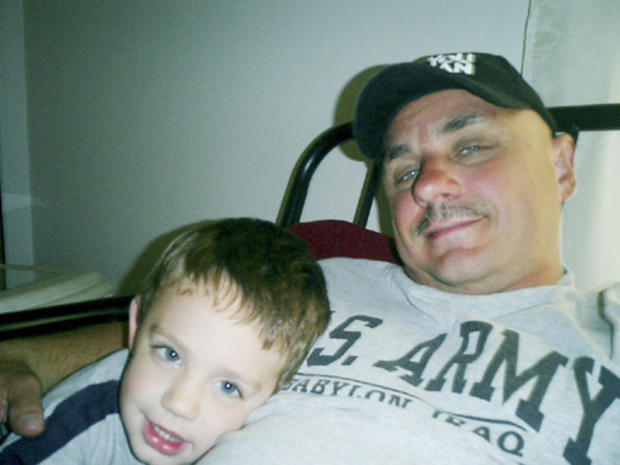 In this 2004 photo provided by Michael Chekevdia, Richard Chekevdia, right, poses with his father Michael Chekevdia in Royalton, Ill. Authorities say the boy, allegedly abducted in a custody dispute two years ago, has been found alive, hidden behind a wal 
