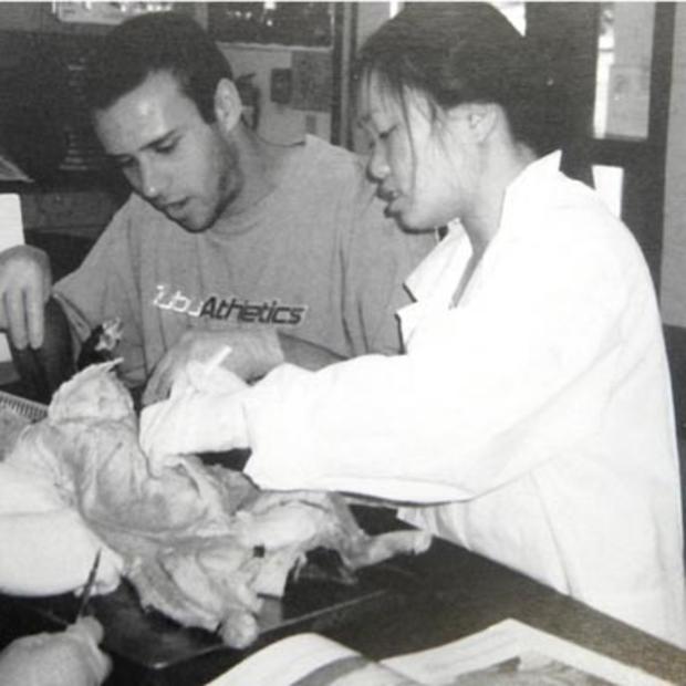 This undated photo provided by Union Mine High School principal Tony DeVille shows Annie Le, foreground, dissecting a cat with another student in a human physiology class. 