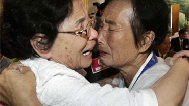 South Korean Ryu Moo-hun, left, cries with his North Korean younger sister Ryu Soon Bock during the reunion meeting, on the Diamond Mountain in North Korea, Saturday, Sept. 26, 2009. 
