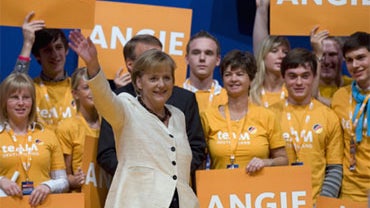 German Chancellor Angela Merkel waves to the crowd during the final rally of the Christian Democratic Party, CDU, before the German general elections in Berlin, on Saturday, Sept. 26, 2009. 