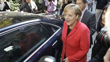 German Chancellor Angela Merkel, party leader of the Christian Democratic Union, CDU, leaves after casting her ballot for the German general elections in Berlin, Germany, Sunday, Sept. 27, 2009. 