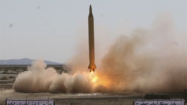 This photo released by the Iranian semi-official Fars News Agency, claims to show the launch of an Iranian Revolutionary Guard Shahab-3 medium-range missile during a drill at an undisclosed location on Monday, Sept. 28, 2009. 