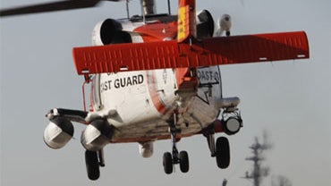 A U.S. Coast Guard MH-60 Jayhawk helicopter lifts off at the San Diego Coast Guard Station during a search effort Friday, Oct. 30, 2009, in San Diego. 