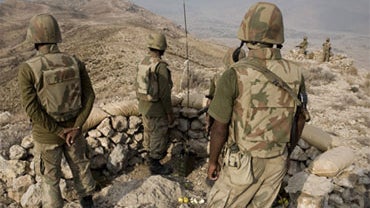 Pakistani soldiers secure an area on top of Kund mountain near Kotkai village in South Waziristan Pakistan on Thursday Oct. 29, 2009. 