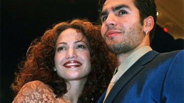 FILE - In this April 7, 1997 file photo Jennifer Lopez arrives with Ojani Noa at a film premiere in the Westwood section of Los Angeles. (AP Photo/Rene Macura, File) 