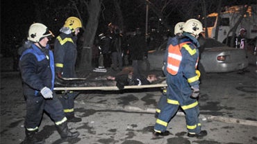 Rescuers carry a victim outside a nightclub in Perm, Russia, early Saturday, Dec. 5, 2009. 