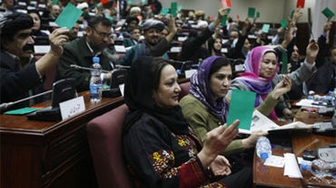 Afghan parliament members vote during a debate in Kabul, Afghanistan, Saturday, Jan. 2, 2010. 