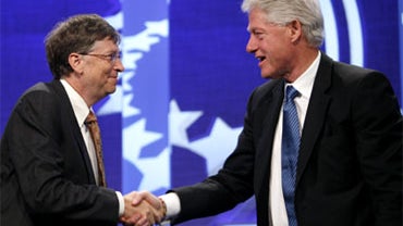 Bill Gates, left, and former President Bill Clinton, right, shake hands before having a discussion on the subject of giving during the Clinton Global Initiative annual meeting Wednesday, Sept. 24, 2008 in New York. 