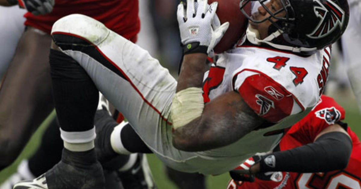 Tampa Bay Buccaneers safety Tanard Jackson (R) hits Seattle