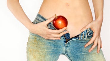 topless, naked, nude, woman, girl, female, holding an apple, sexy teacher, sexy professor, blue jeans 