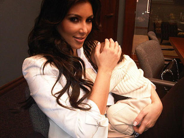 Kim Kardashian holding her nephew Mason. 