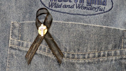 While briefing reporters, West Virginia Gov. Joe Manchin wears a ribbon on his shirt pocket to honor coal miners who were involved in the explosion at the Massey Energy Co.'s Upper Big Branch mine in Montcoal, W. Va. on Friday, April 9, 2010. 