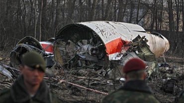 Interior ministry troops guard the site of the Polish presidential plane crash is Smolensk, western Russia, Sunday, April 11, 2010. 
