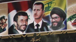 A Damascus restaurant displays a picture of, from left, Iranian President Mahmoud Ahmadinejad, Syrian President Bashar Assad and Hezbollah leader Hassan Nasrallah Friday, April 30, 2010.  