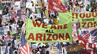 People march for federal immigration reform and against Arizona's controversial immigration law, Saturday, May 1, 2010 in Los Angeles.  