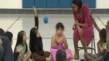 Michelle Obama answers a second-grader who says her mom doesn't have "papers."  